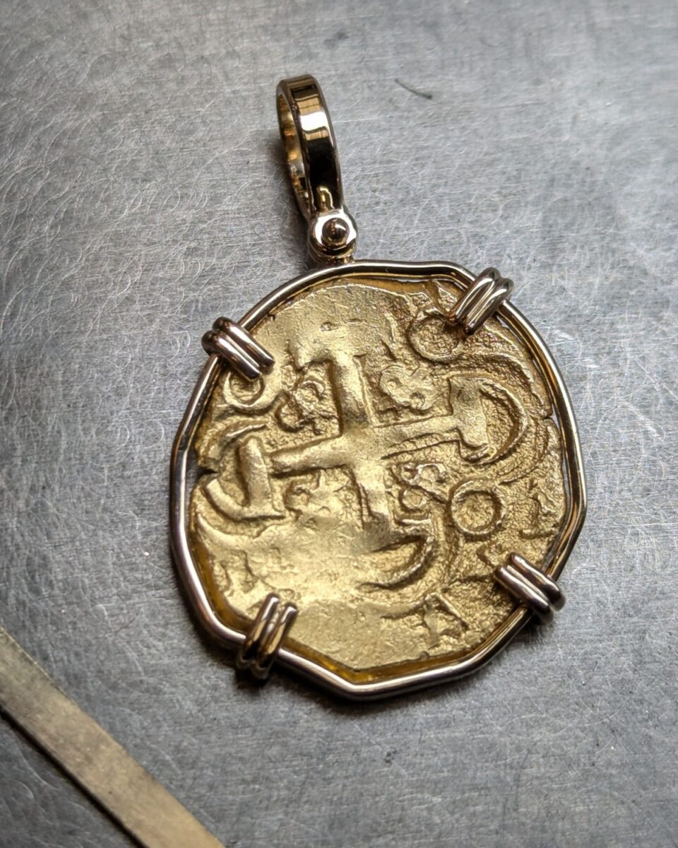 Finished pendant: an antique Spanish two-escudo gold cob held in a handmade gold bezel with a hinged bail