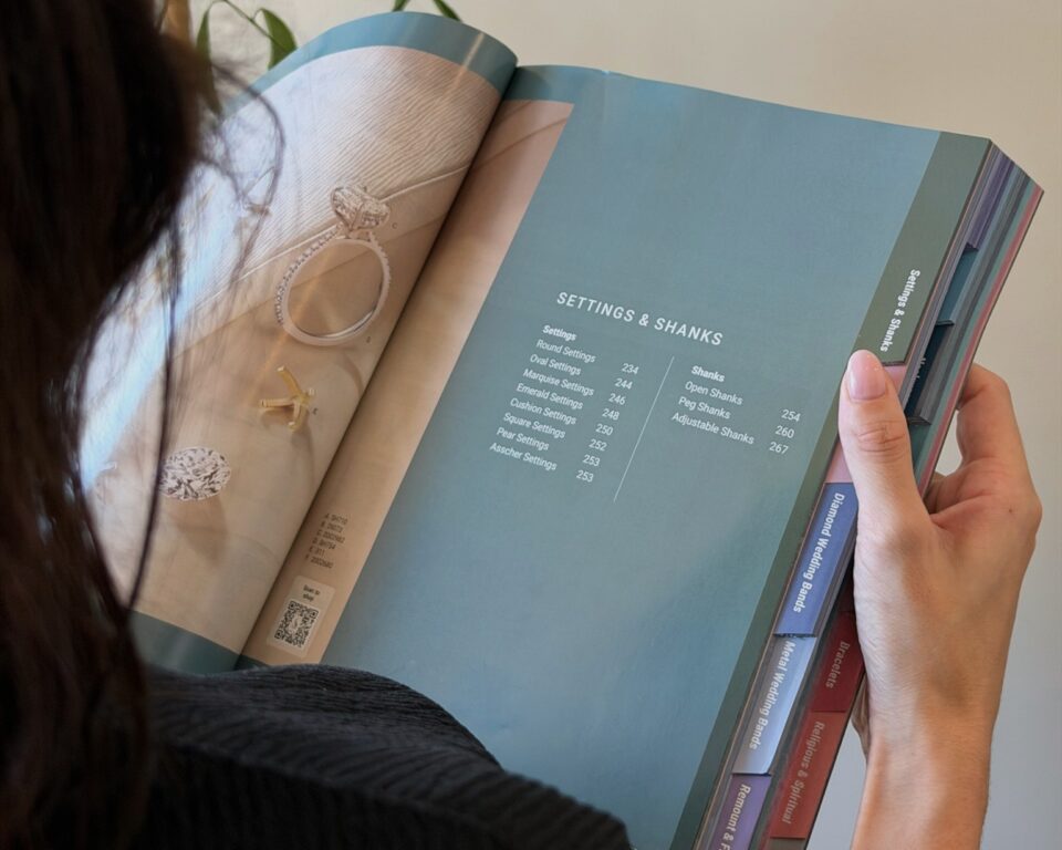 Customer browsing a catalog of ring settings and designs to customize