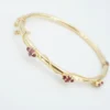 Antique Roped Ruby Hinged Bangle Bracelet, 14k Yellow Gold, view 1